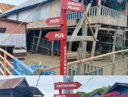 Mahasiswa KKNT Unhas di Desa P. Persatuan Pasang Plang Penunjuk Arah